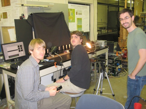 Brad, Luis, and Jeff synchronizing metronomes.